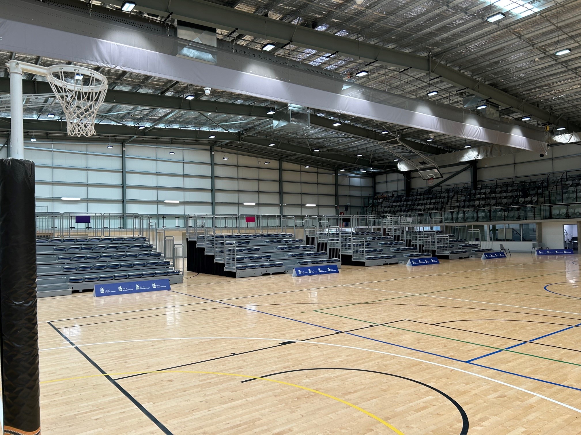 Freestanding seat on the side of the courts in an indoor sports stadium.