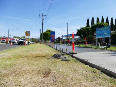 A section of shared path constructed of freshly poured concrete.